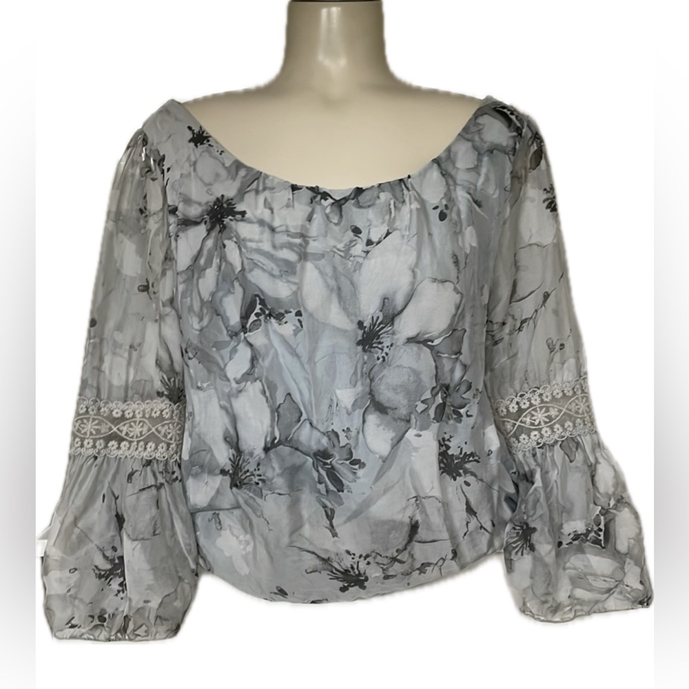 Delicate lined over the head blouse with lace sleeves and bubble hem.